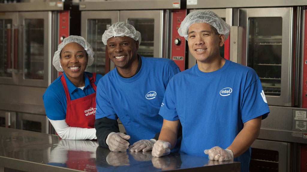 an image of 3 adults working in the Meals on Wheels kitchen