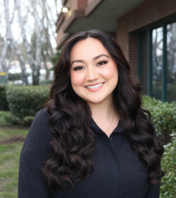 Staff Photo wearing black with building background